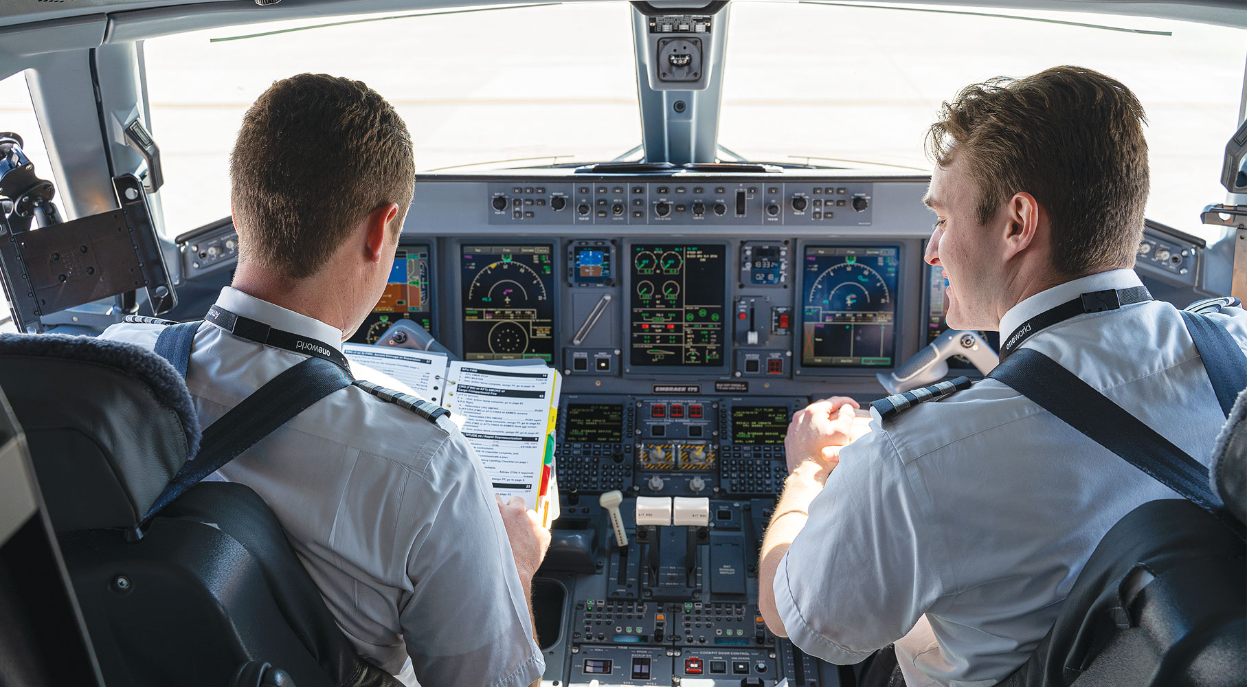 ATP Flight School Graduates Sitting in American Eagle Airplane Cockpit